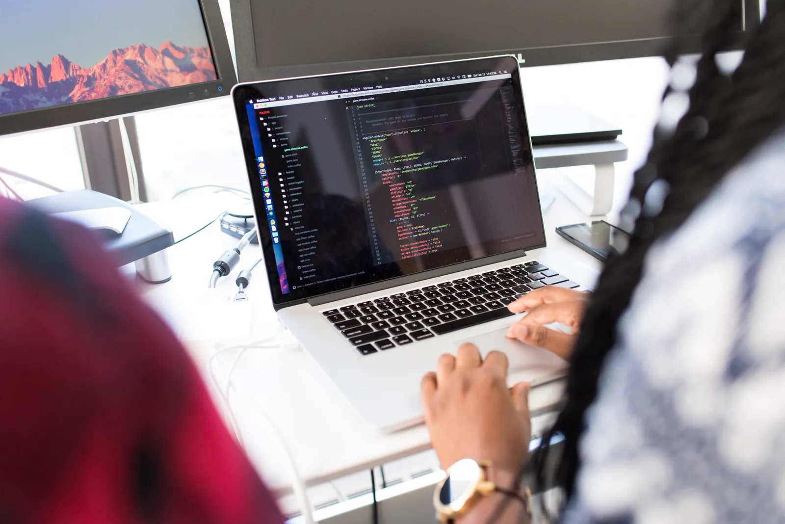 Software engineer developing an application at a workstation